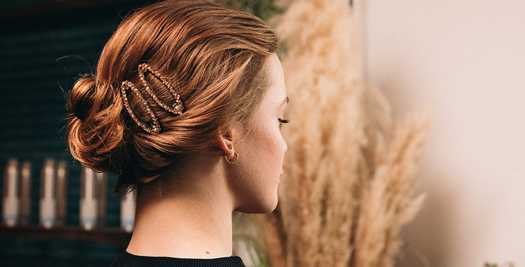 picture of a low bun with sparkly hair clips